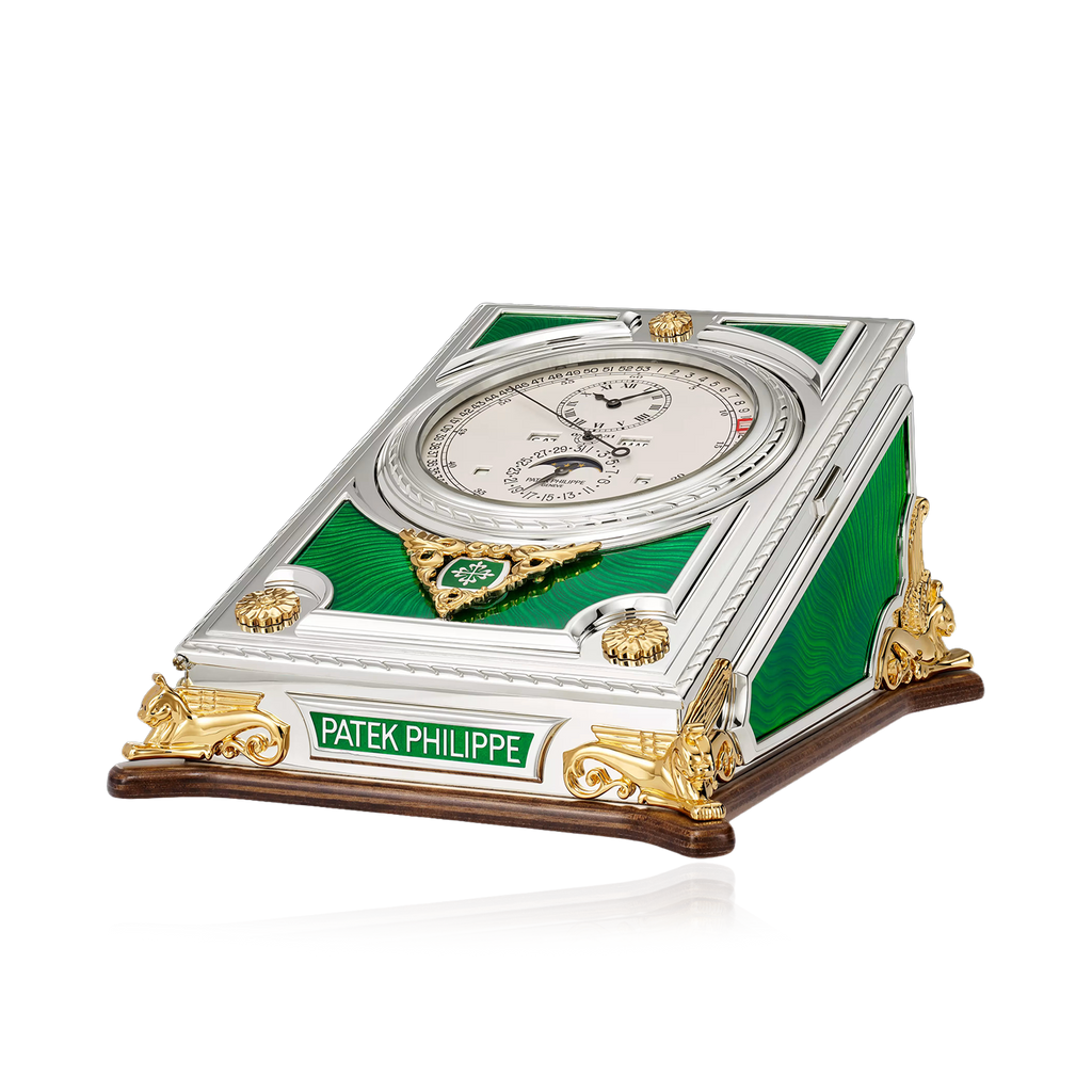 Patek Philippe clock with green and gold design on a white background