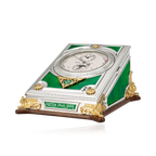 Patek Philippe clock with green and gold design on a white background