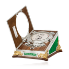 Patek Philippe compass in an open wooden box on a white background