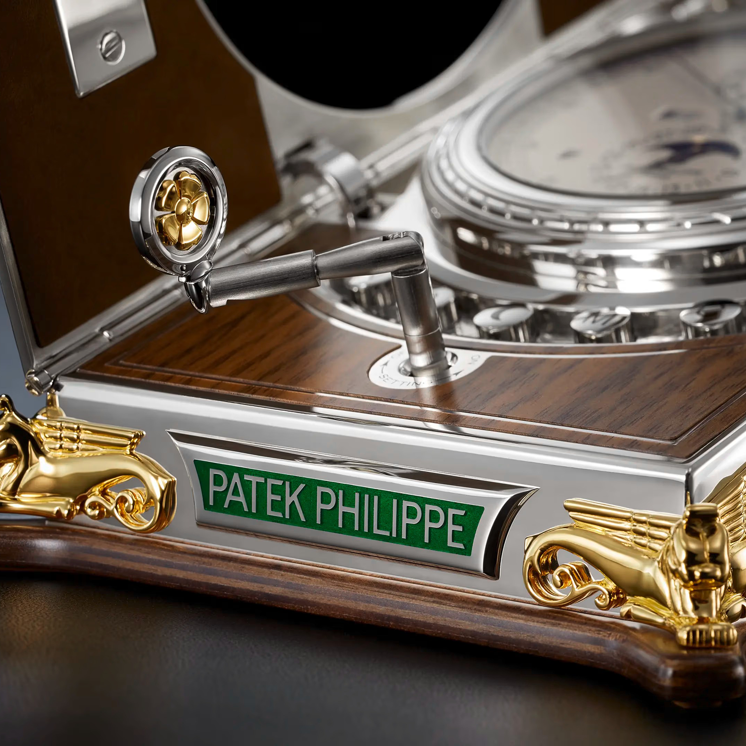 Close-up of a Patek Philippe watch with intricate design and gold accents.