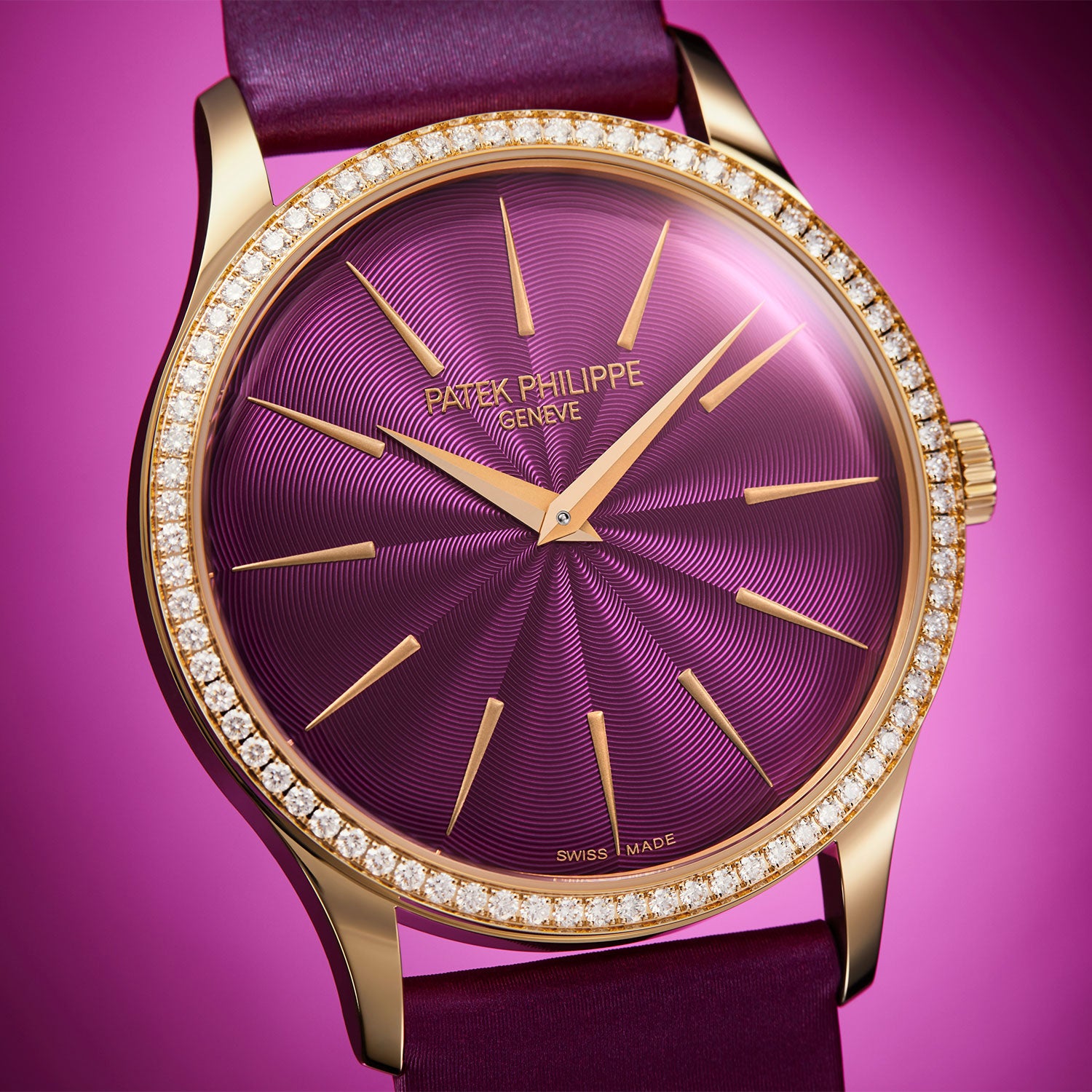 Luxury Patek Philippe watch with purple face and gold accents on a pink background
