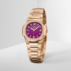 Gold watch with a purple face on a light gray background