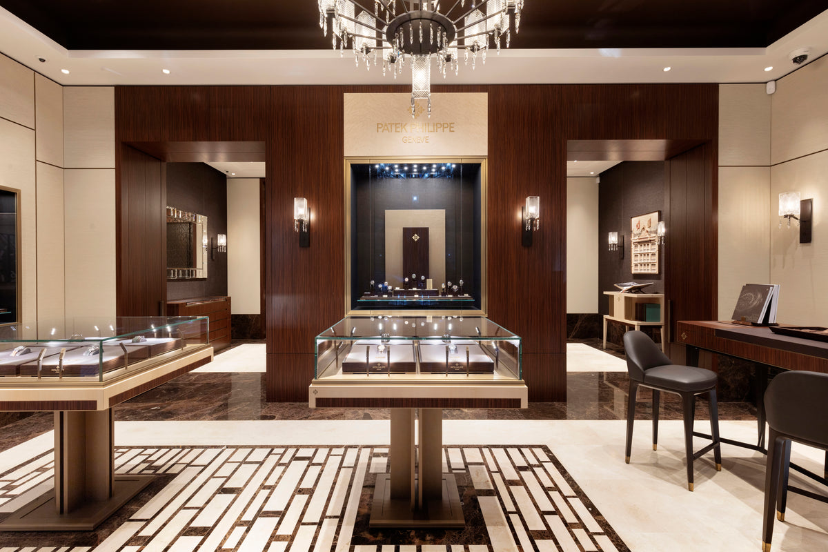 Luxury interior design with glass display cases and high-end decor.