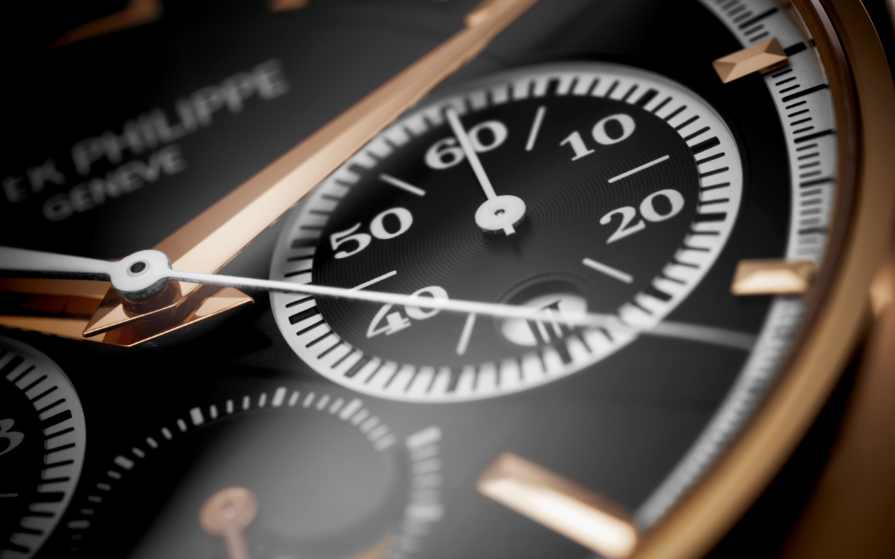Close-up of a luxury watch with detailed face and brand name.